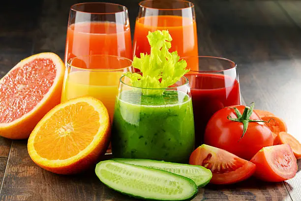 Photo of Glasses with fresh organic vegetable and fruit juices