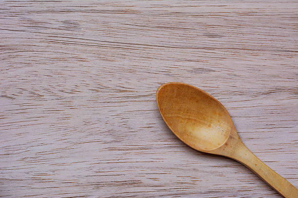 istock wooden and spoon on wooden top view 520704112