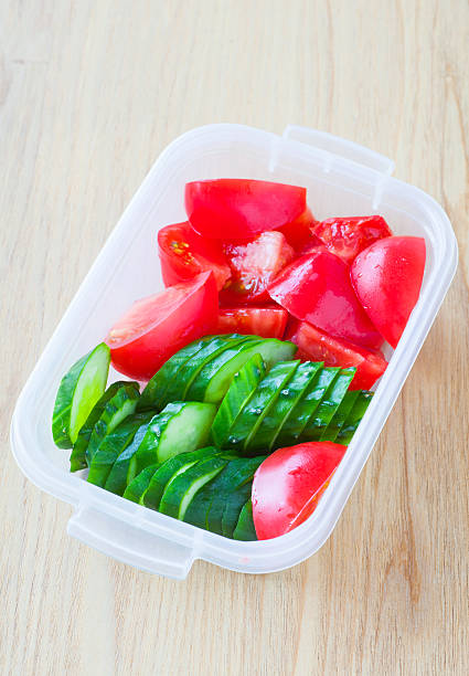 istock Slice cucumber  and slice tomato in plastic lunch box 520704362