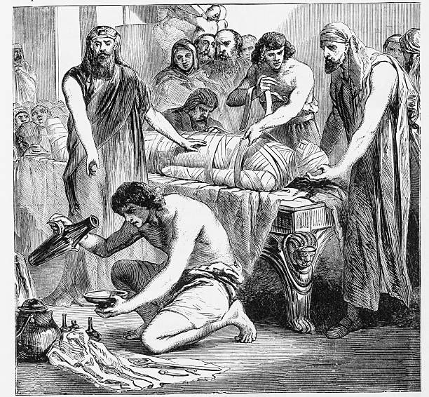 Process of Embalming Illustration depicting  the embalmong of a body by ancient Egyptians..Source: Ridpath, John Clark Cyclopedia of Universal History (Volume 1) (Cincinnati, OH: The Jones Brothers Publishing CO., 1885) ancient history stock illustrations