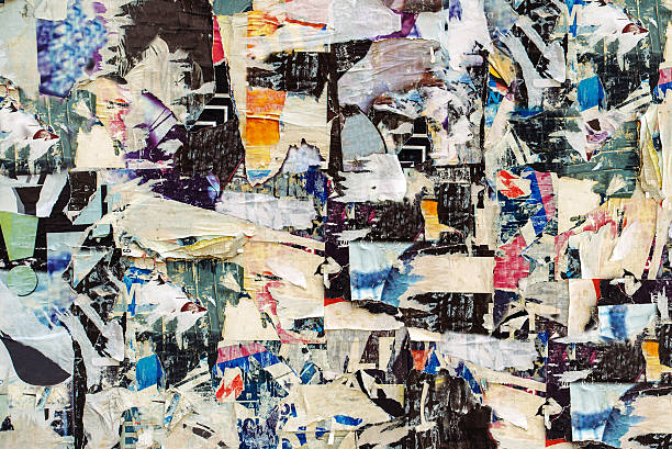 istock Advertising posters paper scraps on wall as urban background 520704686