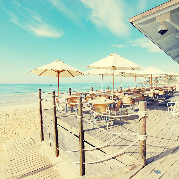istock outdoor terrace cafe on sand beach 520706057