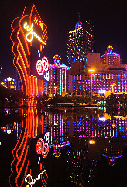 Macau, Macau S.A.R. - November 23, 2015: The night facades of Grand Lisboa Macau casino resort and Wynn,  luxury hotels in Macau Peninsula.