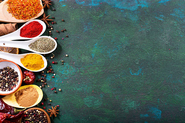 istock various spices in spoons on old green background 520707832