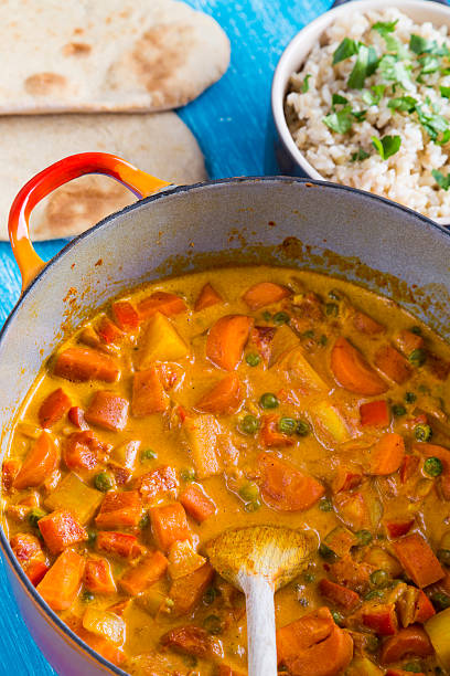 istock Pot of vegetable korma curry with rice 520708464