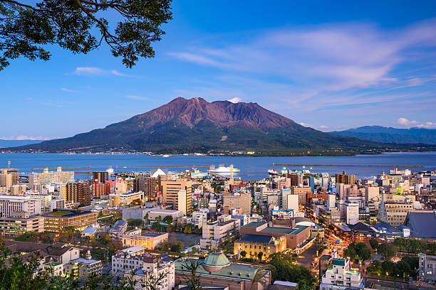 Kagoshima Japan Skyline Kagoshima, Japan city skyline with Sakurajima Volcano. kyushu photos stock pictures, royalty-free photos & images