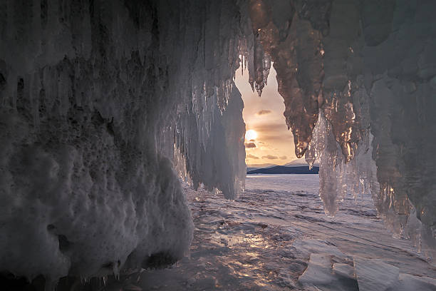istock Curtain of icicles on sunset sky background 520708944