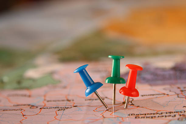 istock pins attached to map, showing location or travel destination 520709634