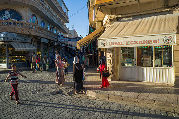 people are walking at street of midyat mardin turkey mardin, turkey - September 6, 2013: people are walking at street of midyat mardin turkey midyat photos stock pictures, royalty-free photos & images