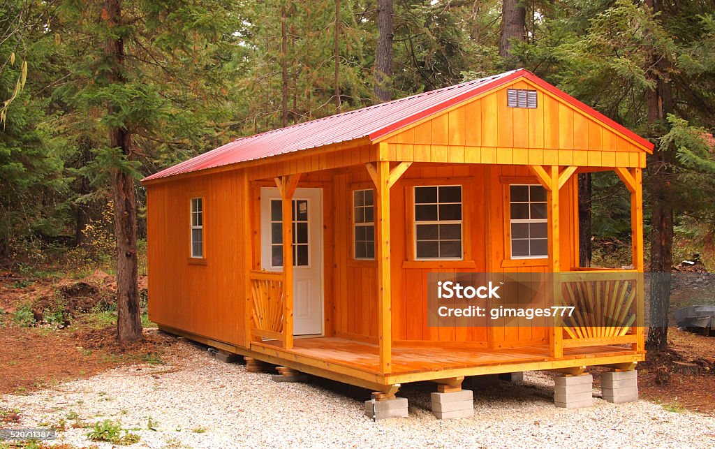 Modern cabin nestled in woods photo. Washington State forest with modern cabin photo. Shed Stock Photo