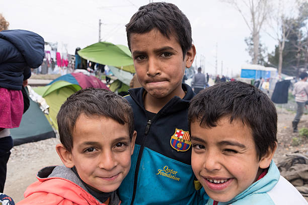 Boys in refugees camp in Greece stock photo
