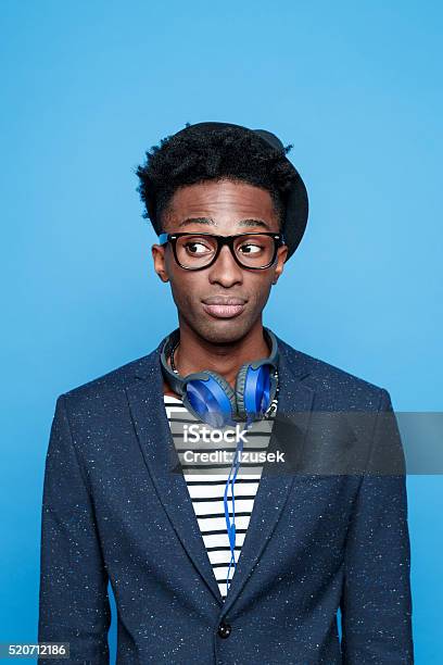 Fashionable Afro American Young Man Against Blue Background Stock Photo - Download Image Now