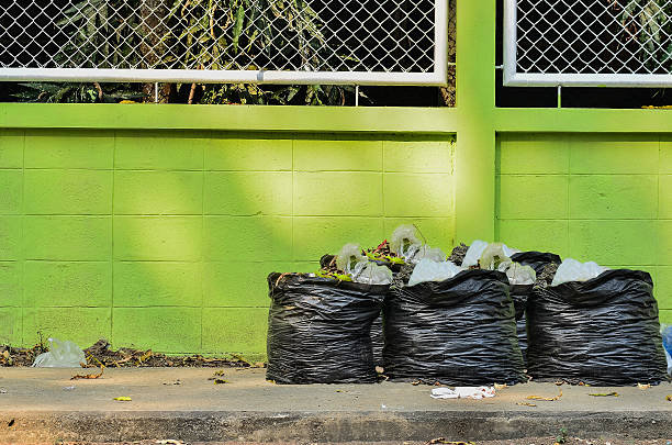 istock garbage and waiste in black bags 520712592