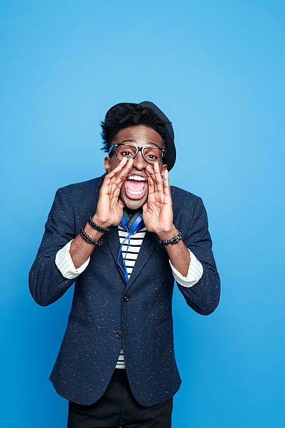istock Fashionable afro american guy shouting at camera 520712626