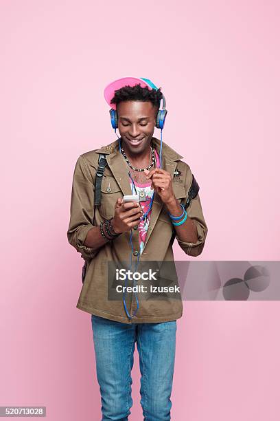 Happy Afro American Student Using Smart Phone Studio Shot Stock Photo - Download Image Now