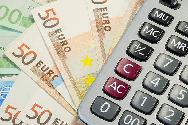 istock Euro money bills and calculator 520713926