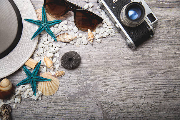 istock Travel and vacation items on wooden table 520714342