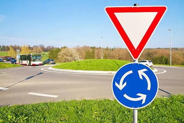 Roundabout road warning sign on a street