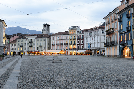 Locarno, Switzerland - 15 march 2016: people walking in front of old houses on piazza grande square at Locarno on the italian part of Switzerland