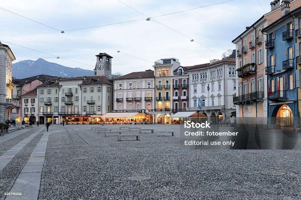 Old houses on piazza grande square at Locarno Locarno, Switzerland - 15 march 2016: people walking in front of old houses on piazza grande square at Locarno on the italian part of Switzerland Locarno Stock Photo