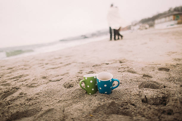 istock Two cute colorful cups with white polka dots at the 520715278