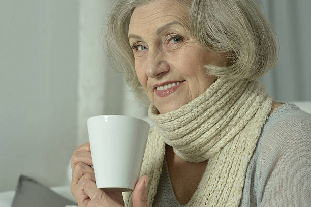 istock sick senior woman  with  tea 520715312