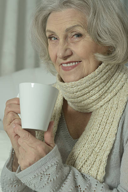 istock sick senior woman  with  tea 520715518
