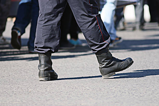 istock legs police in army boots 520730467
