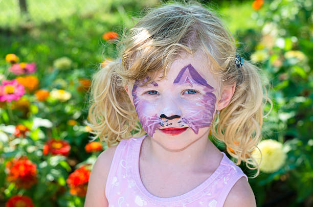 istock girl with face painting 520730561