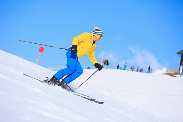 istock Senior men snow skier skiing on sunny ski resorts 520730893