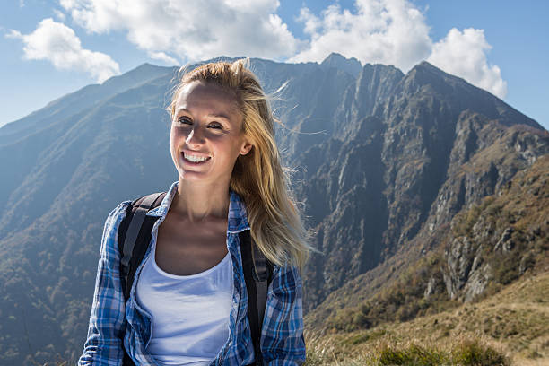 istock Cheerful tourist on top of mountain 520732677