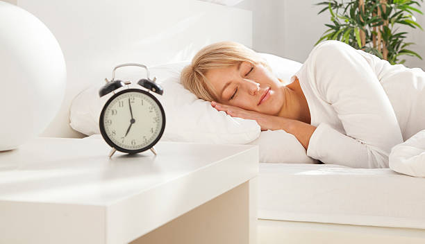 istock beautiful girl sleeping in her bed. focus on face 520733819