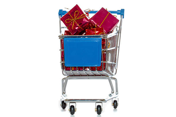 Shopping cart with presents stock photo