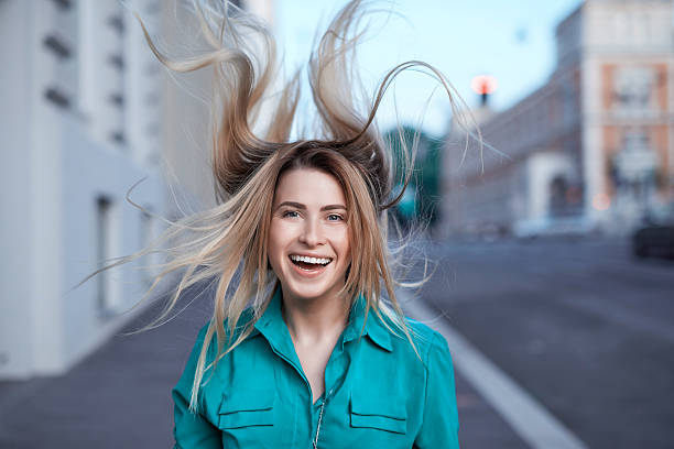 istock fun with my hair in the wind 520734852