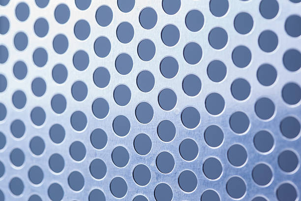 istock Metal background with holes 520735605