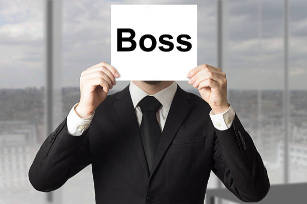 istock businessman hiding face behind sign boss 520735753