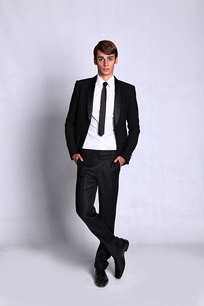 istock Male model is wearing a black and white suit 520736251