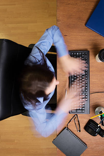 istock woman working at desk shot from above 520736417