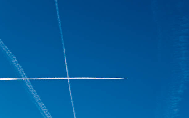 istock Aircraft contrails in the sky 520736915