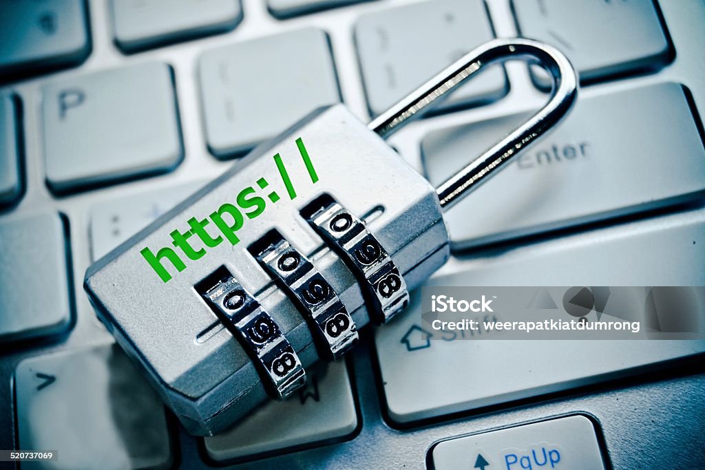 https security lock with https on computer keyboard Security Stock Photo