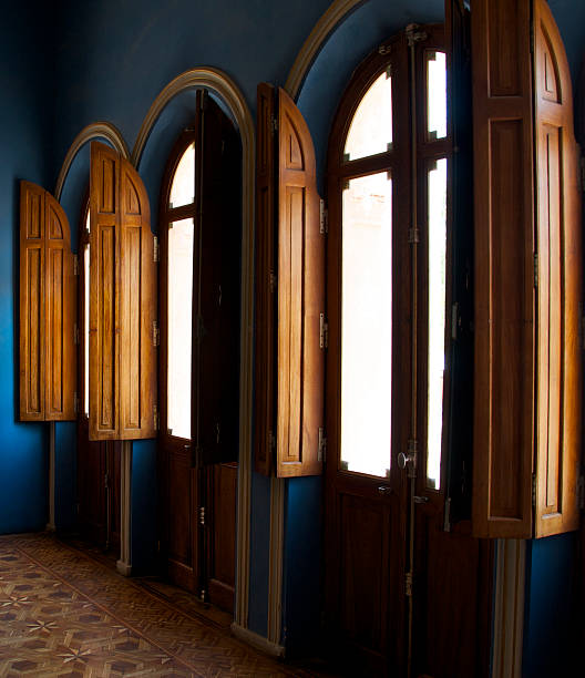 istock Wooden Shutters In a Blue Room 520737120