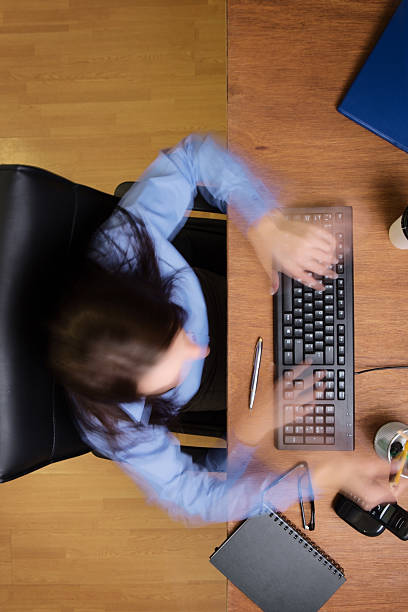 istock woman working at desk shot from above 520738195