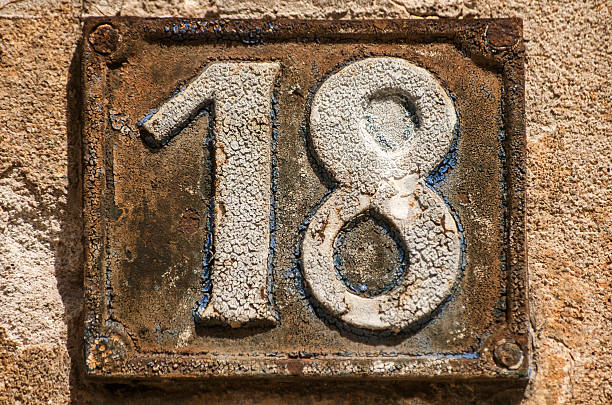 istock Old retro cast iron plate number 18 520739810