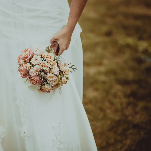 istock Bride holding stylish wedding bouquet 520740720