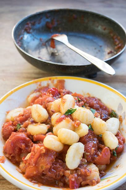 istock potato dumplings  with tomato sauce 520740744
