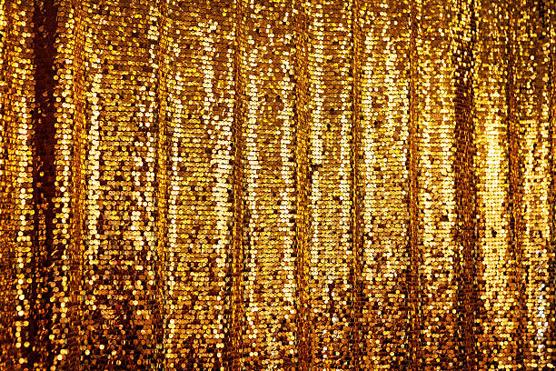 Abstract golden glitter background Abstract golden glitter background. Festive background with copyspace, hanging curtain tinsel stock pictures, royalty-free photos & images