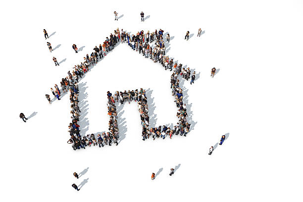 Group of people forming a house icon