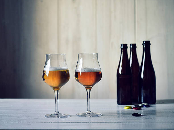 istock Two glasses with different types of beer and beer bottles 520742114