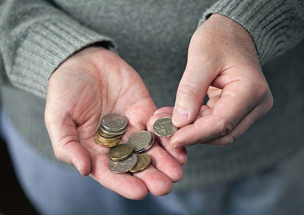 istock elderly man counting the coins 520743602
