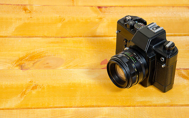 istock Old SLR camera on the wood surface 520744094